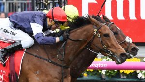 Jockey Kerrin McEvoy on Almandin (left) wins as he races with Heartbreak City, ridden by Joao Moreira, at the finish line in the Melbourne Cup on Melbourne Cup Day at Flemington Racecourse in Melbourne, Tuesday. Nov. 1, 2016. (AAP Image/Tracey Nearmy) NO ARCHIVING, EDITORIAL USE ONLY